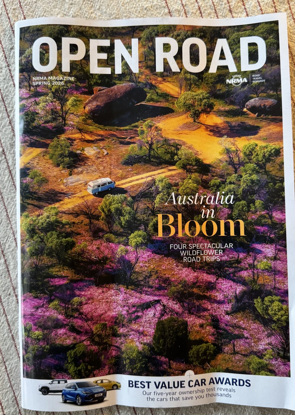 Cover of NRMA's Open Road magazine, Spring 2026 issue, showing the cover story Australia in Bloom: Four Spectacular Wildflower Road Trips and a Best Value Car Awards sidebar.